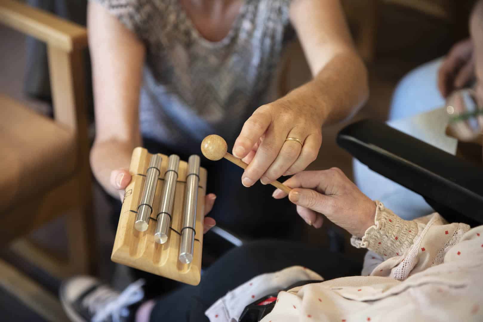 A child reaching for a drum
